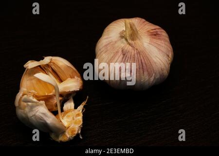 Garlic cloves on a black background Stock Photo
