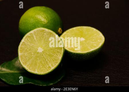 close up shoot of green fresh lime on a black background Stock Photo