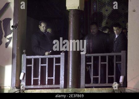 Investigators look out from a hotel balcony at the crime scene where a double bombing which left at least one French tourist dead and over 20 injured occured in the Khan El Khalili market in Cairo, Egypt on February 22, 2009. Photo by Victoria Hazou/ABACAPRESS.COM Stock Photo