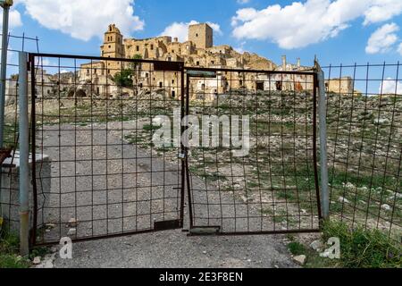 View of Craco, a ghost town in Matera province abandoned due to a landslide, now a popular tourist destination and filming location, Basilicata, Italy Stock Photo