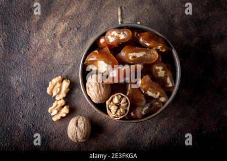 Churchkhela Pestil or Walnut Fruit Pulp in bowl on dark background. Stock Photo