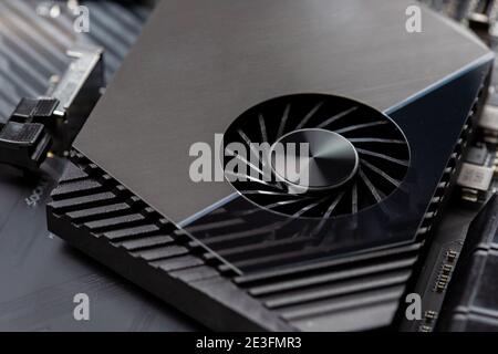 Motherboard on a table close-up, inside of a desktop computer showing chips, circuit boards and components Stock Photo