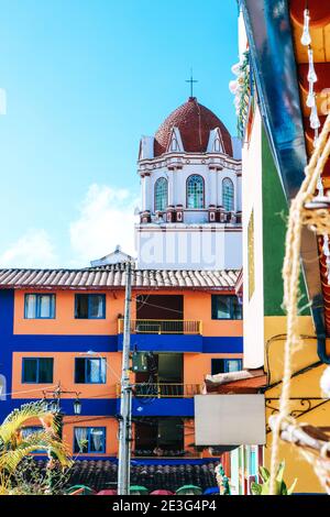 The colourful Plazoleta de Los Zócalos in Guatape village in Colombia with beautiful Zocalo paintings Stock Photo