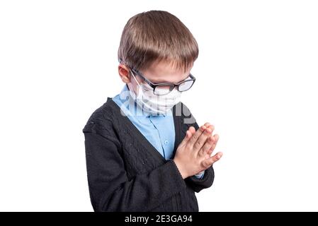 The boy in the mask is praying. Isolated on white background. High quality photo Stock Photo