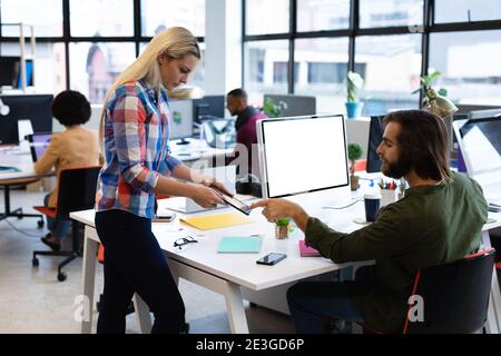 Caucasian business people working in creative office Stock Photo