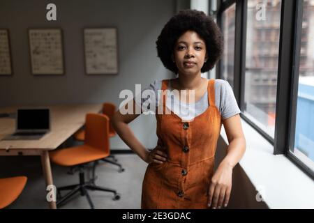 Mixed race businesswoman working in creative office Stock Photo