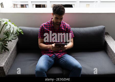 Mixed race businessman working in creative office Stock Photo
