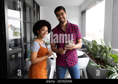 Two mixed race business people working in creative office Stock Photo