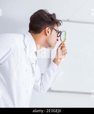 The funny doctor scientist making presentation in hospital Stock Photo