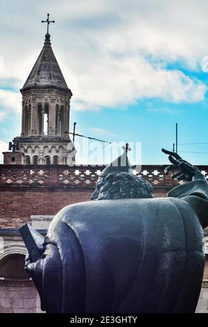 Historical bell tower and statue of bishop Grgur Ninski, landmarks in Split, Croatia./ Famous statue/ Stock Photo