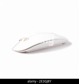 White wireless computer mouse. Isolated on a white background. Side view Stock Photo