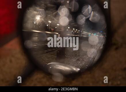 Berlin, Germany. 19th Jan, 2021. In the mirror of a motorcycle you can see a part of the Straße des 17. Credit: Paul Zinken/dpa/Alamy Live News Stock Photo