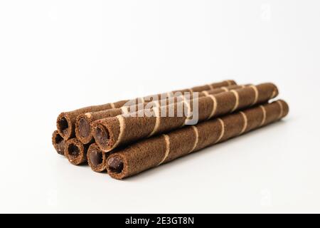Chocolate wafer rolls on a white background Stock Photo