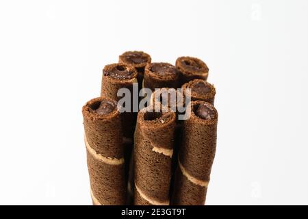 Chocolate wafer rolls on a white background Stock Photo