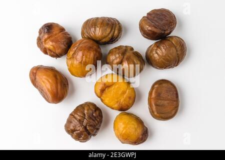Roasted chestnuts on a white background Stock Photo