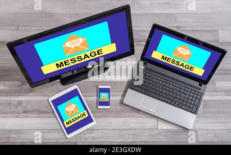 Message concept shown on different information technology devices Stock Photo