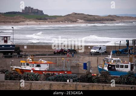 Dubstanburgh Castle seen from the harbour at Seahouses, Northumberland Stock Photo
