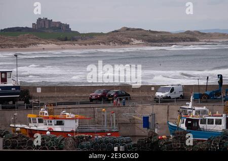 Dubstanburgh Castle seen from the harbour at Seahouses, Northumberland Stock Photo