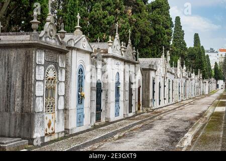 Crypts and details of the family tombs on the old city cemetery Cemiterio dos Prazeres in Lisbon, Portugal in Europe Stock Photo