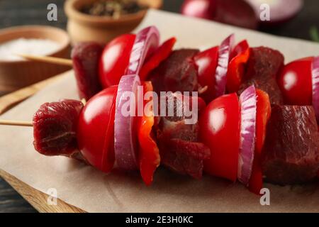 Cutting board with raw shish kebab, close up Stock Photo