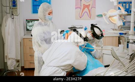 Nurse talking to patient wearing PPE Stock Photo - Alamy