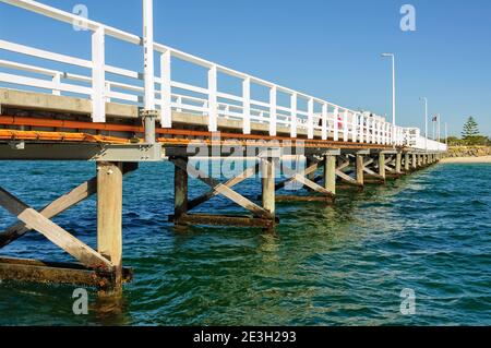 The heritage listed 1.8 kilometres long Busselton Jetty over the waters of Geographe Bay is the longest timber-piled jetty in the Southern Hemisphere Stock Photo