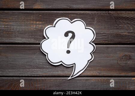 Question mark symbol on speech bubble, top view Stock Photo