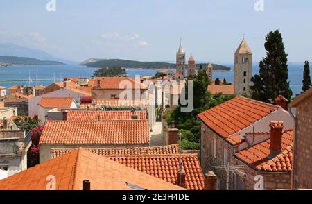 view over the terracotta tiles roofs of the upper town in  Rab town, Rab Island Croatia. Stock Photo