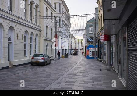 A near deserted Castle Street in Douglas, Isle of Man during a three week lockdown for Covid during January 2021 Stock Photo