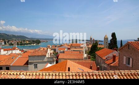 view over the terracotta tiles roofs of the upper town in  Rab town, Rab Island Croatia. Stock Photo