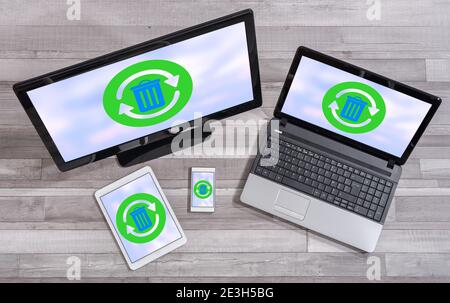 Recycling concept shown on different information technology devices Stock Photo