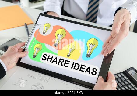 Share ideas concept shown by a businessman Stock Photo