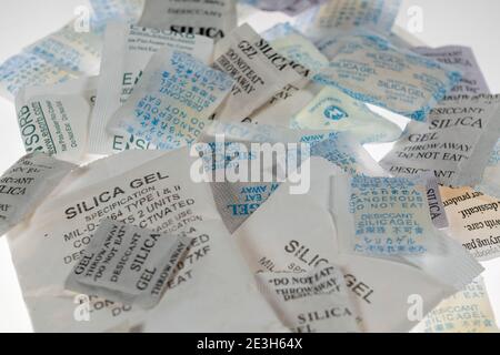 Silica gel, desiccant, is often used in packaging of technical equipment, packed in small bags, anti-condensation bags, Stock Photo