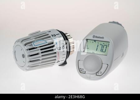 Heating thermostats, digital and manual thermostats, for heat control on heating systems, Stock Photo