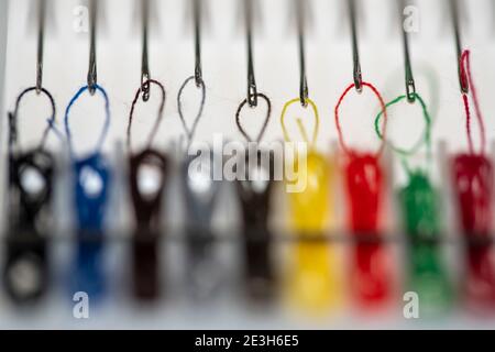 Sewing kit, sewing thread and sewing needles, already threaded, different colours, ready to sew, hotel amenities, Stock Photo