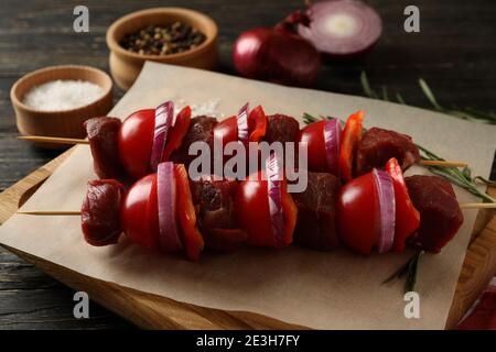 Cutting board with raw shish kebab, close up Stock Photo