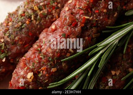 Raw lula kebab with herbs and spices, close up Stock Photo