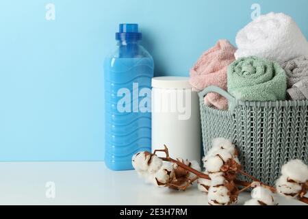 https://l450v.alamy.com/450v/2e3h7rm/laundry-accessories-on-white-table-against-blue-background-2e3h7rm.jpg