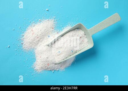 Washing laundry detergent powder and blue plastic measuring cup, top view  Stock Photo - Alamy