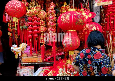 Red lanterns and other traditional decorative elements for Chinese (or Lunar) New Year at a shop in Yaowarat, Bangkok, Thailand. Stock Photo
