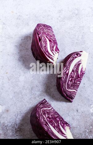 Raw red cabbage prepared in wedges before going in the oven to roast. Stock Photo
