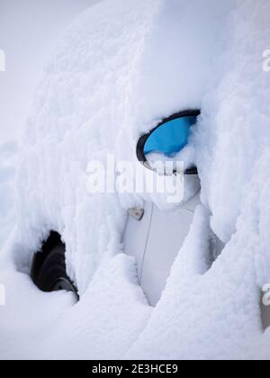 Car completely covered by snow in Madrid's biggest snow storm in 70 years. Stock Photo