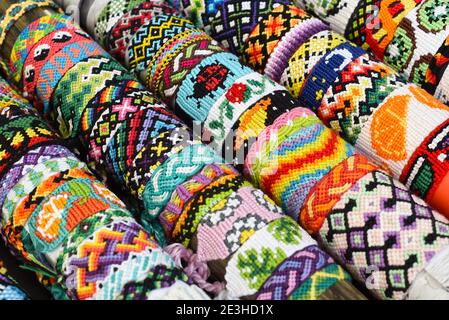 Two woven DIY friendship bracelets with alpha patterns Space Stock Photo -  Alamy