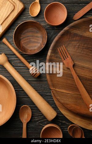 Different wooden kitchenware on wooden table, top view Stock Photo