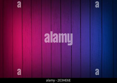 Neon light on wood wall texture background. Lighting effect red and blue neon backgrounds. Stock Photo