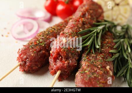 Raw lula kebab, herbs and spices, close up Stock Photo