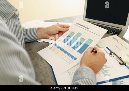 Concept of finance with man doing a financial planning Stock Photo