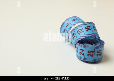 Measuring tape on white background, space for text Stock Photo