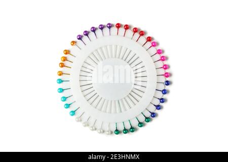 Multi colored needles isolated on white background Stock Photo