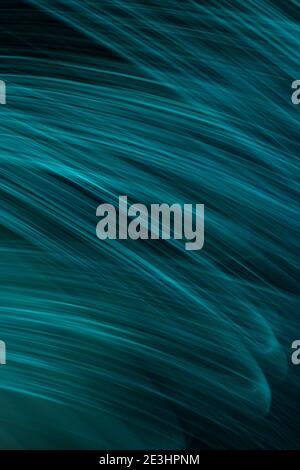 thin blue light lines on a black background Stock Photo